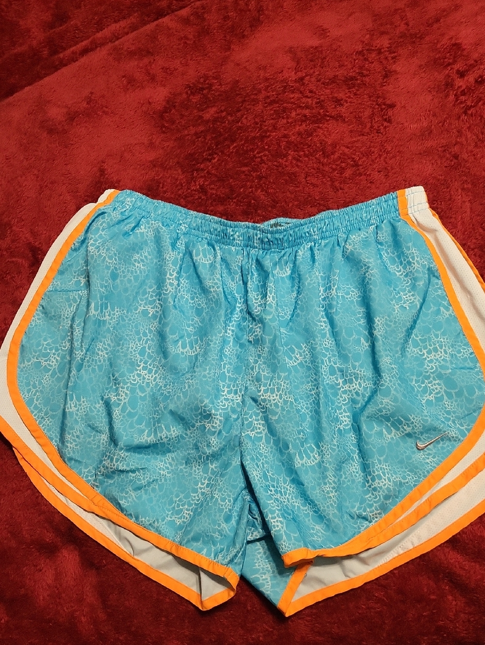Nike Women's Light Blue Athletic Shorts with Orange Trim